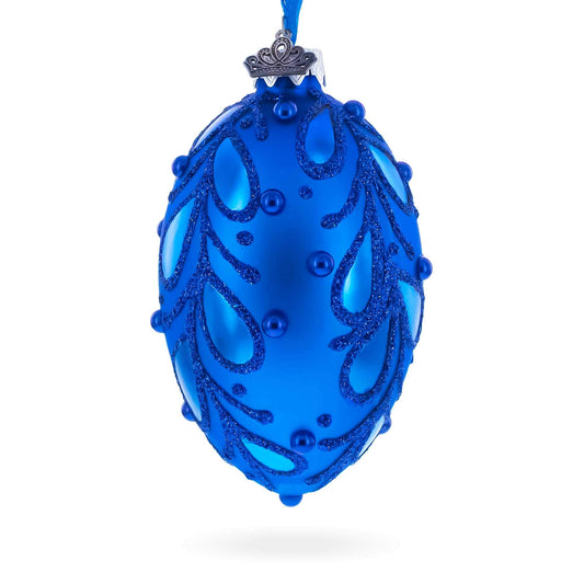 a blue ornament with glittery design