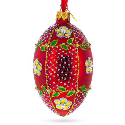 a red and gold decorated christmas ornament