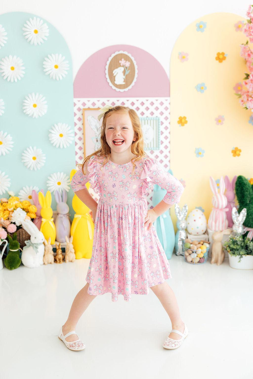 a girl in a pink dress