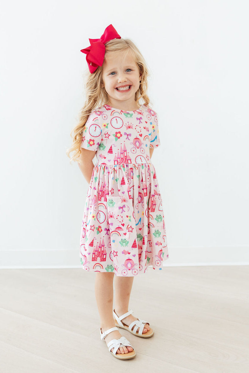 a girl smiling with a red bow
