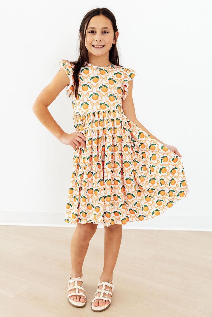 a girl in a dress