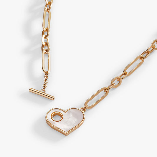 a gold chain with a heart pendant