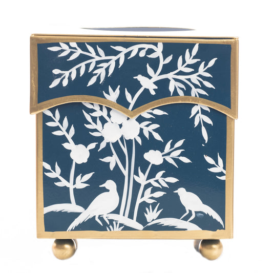 a blue and gold box with white birds on it