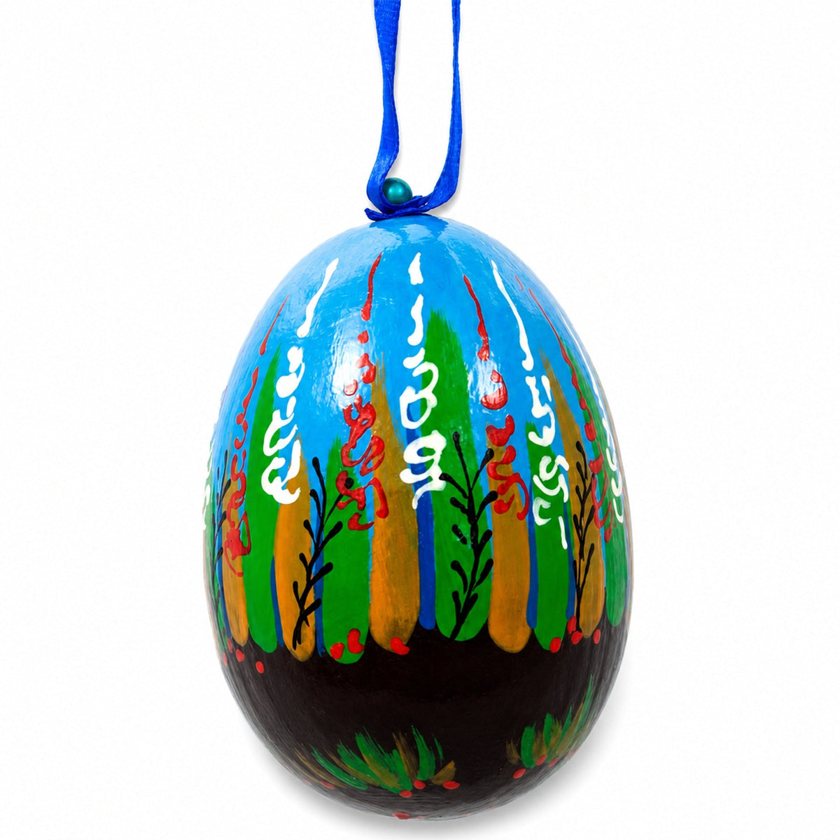 a painted egg with a blue ribbon