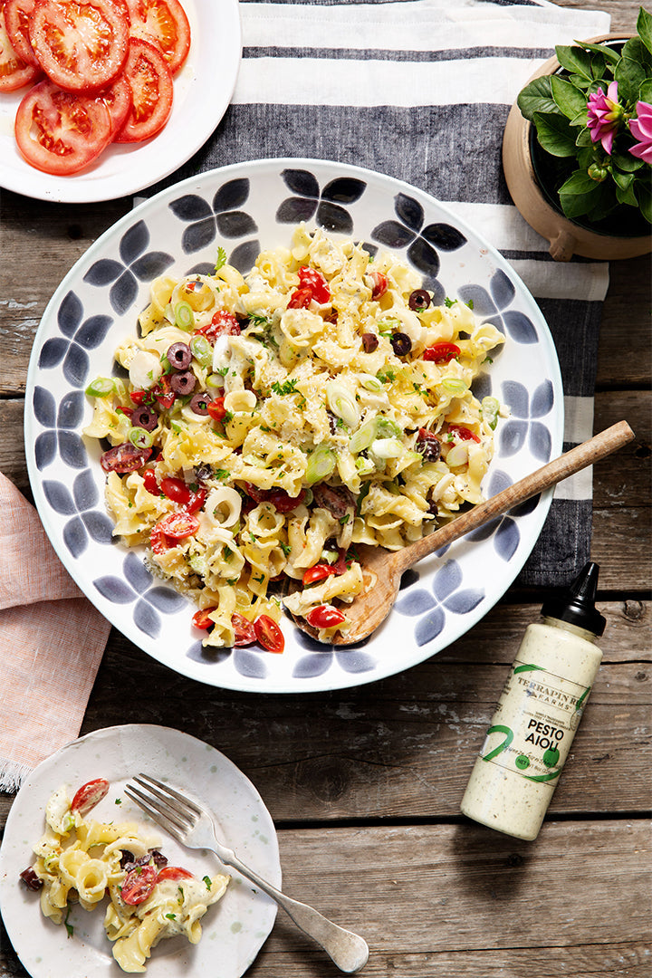 a plate of pasta with vegetables and cheese