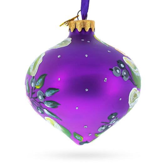 a purple ornament with white flowers and leaves on it