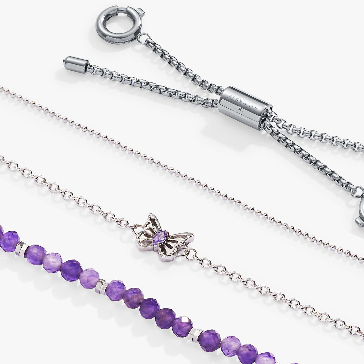 a group of silver bracelets