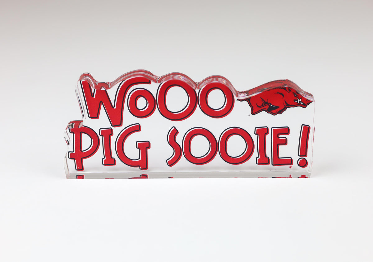 a red and white sign with a pig on it