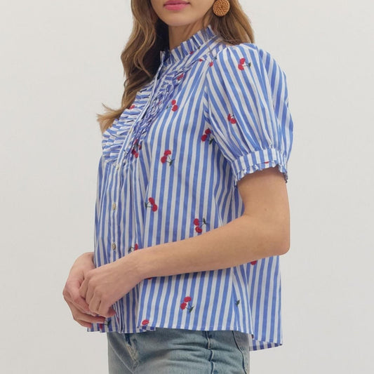 The Merry Hare blue and white striped cotton top with embroidered cherries, ruffle bib front, and puff short sleeves.