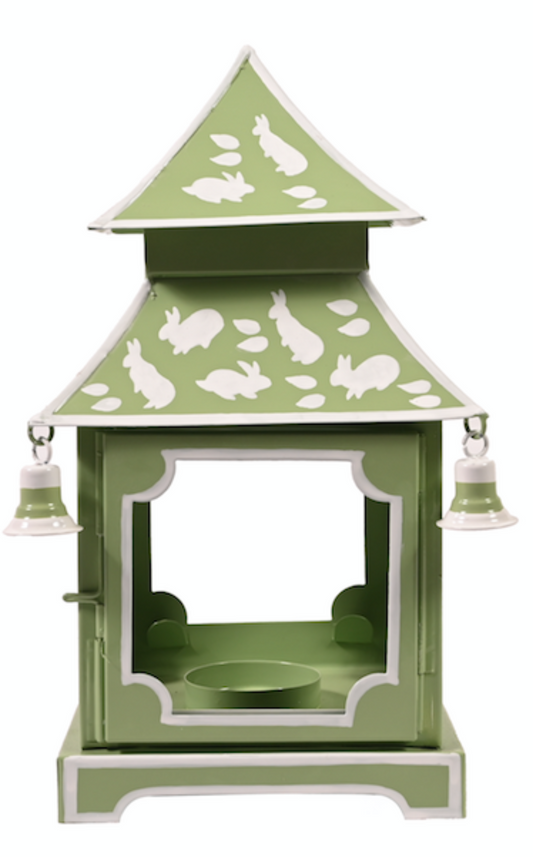 a green and white object with white rabbits on it