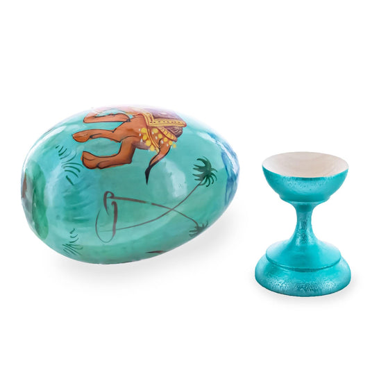 a blue egg with a brown elephant on it next to a blue egg