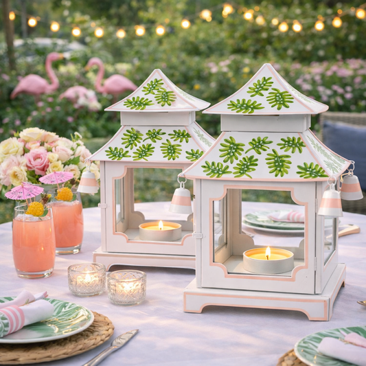 a table with a couple of lanterns and candles
