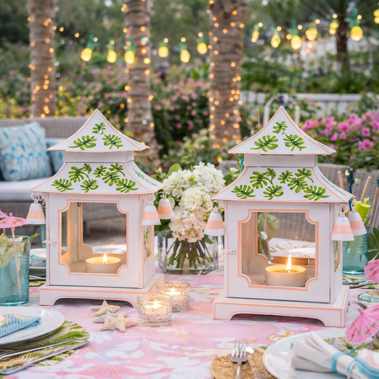 a table set with lanterns and candles