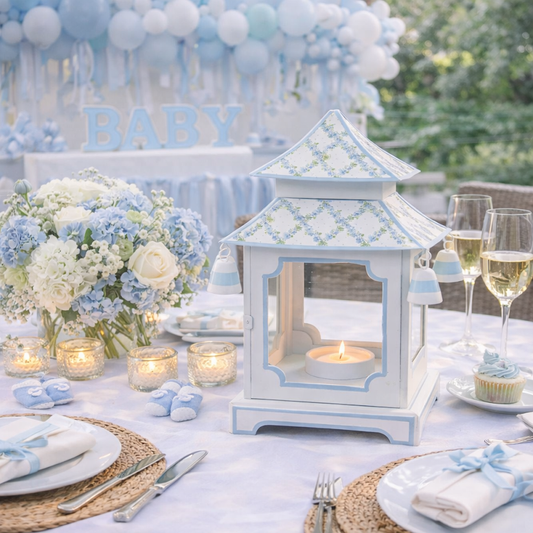 a table with a lantern and flowers