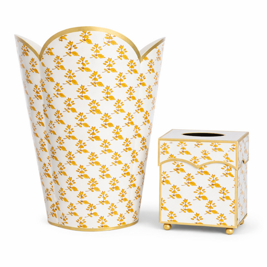 a white and orange vase and a box