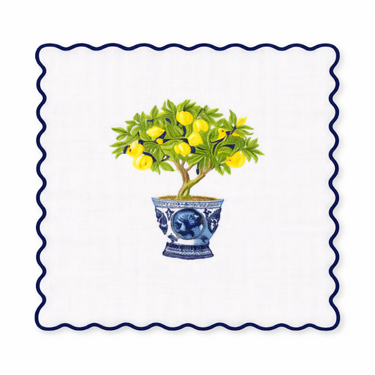 a lemon tree in a blue and white pot