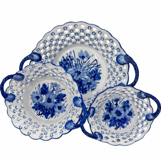 a group of blue and white china plates