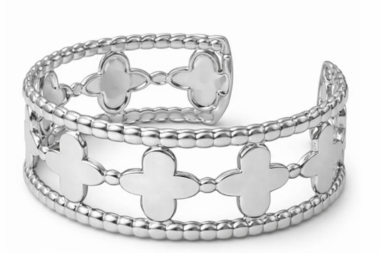 a silver bracelet with four clovers