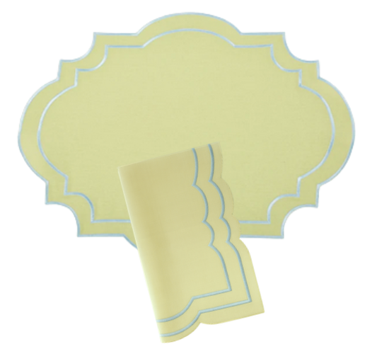 a yellow place mat with blue trim