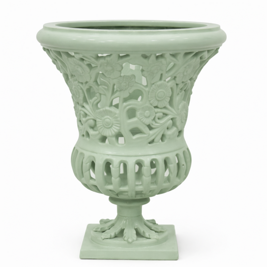 a white vase with a carved design