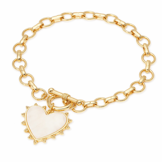 a gold bracelet with a heart pendant
