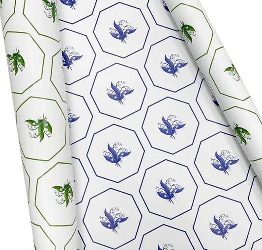 a roll of wrapping paper with blue and green design