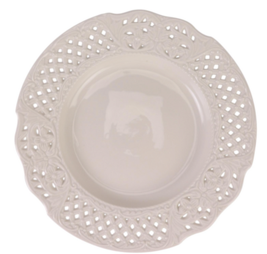 a white plate with lace trim