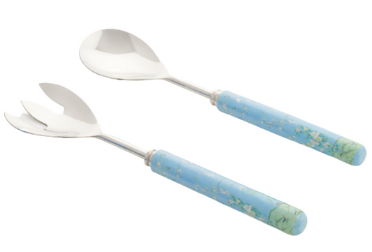 a pair of spoons with blue handle