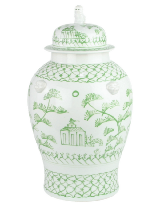 a white and green vase with a lid