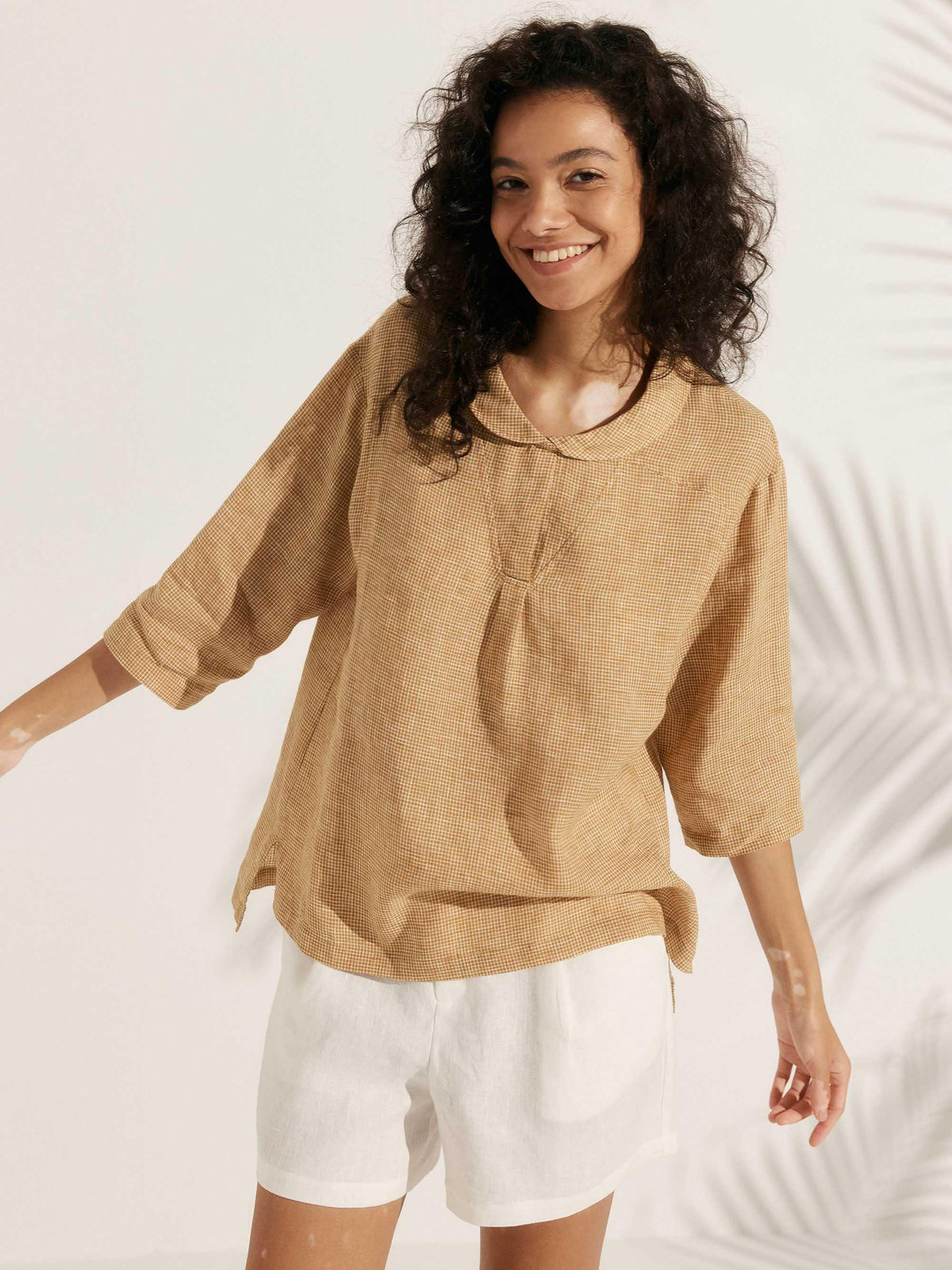 a woman smiling with her arms out