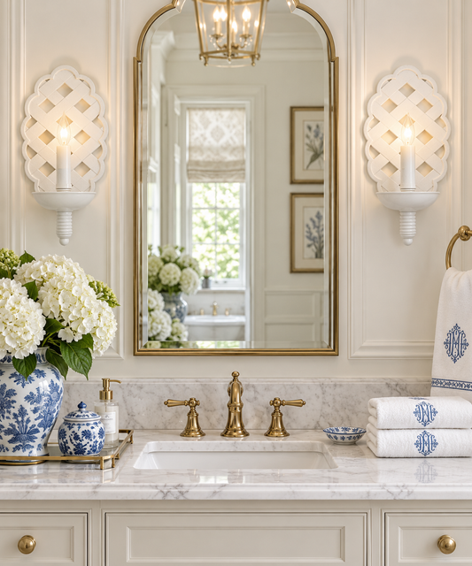 a bathroom with a mirror and a vase of flowers