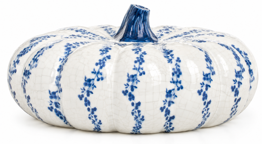 a white and blue painted pumpkin