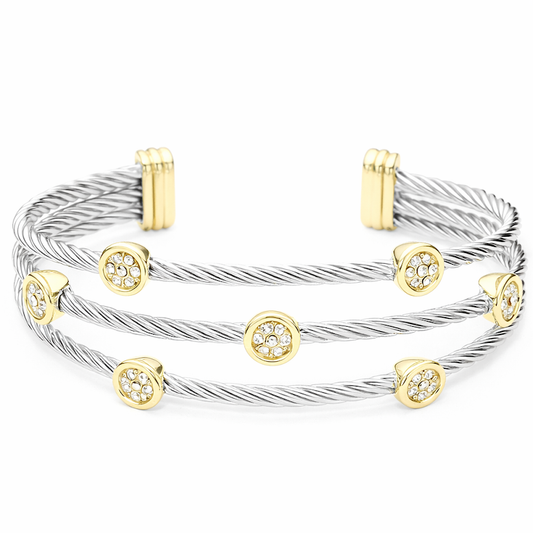 a silver and gold bracelet with diamonds