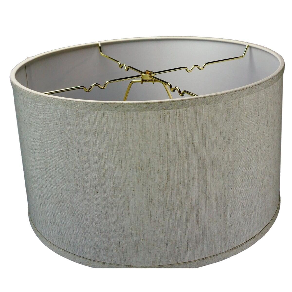a white lamp shade with gold wire