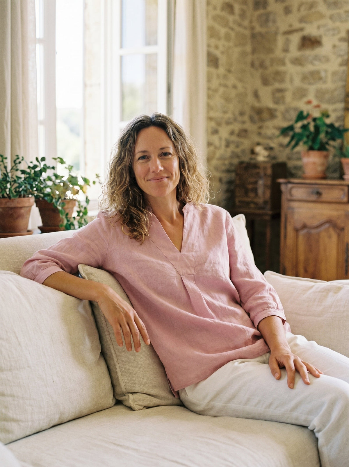 a woman sitting on a couch