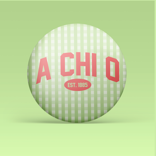 a green and white striped button with red text
