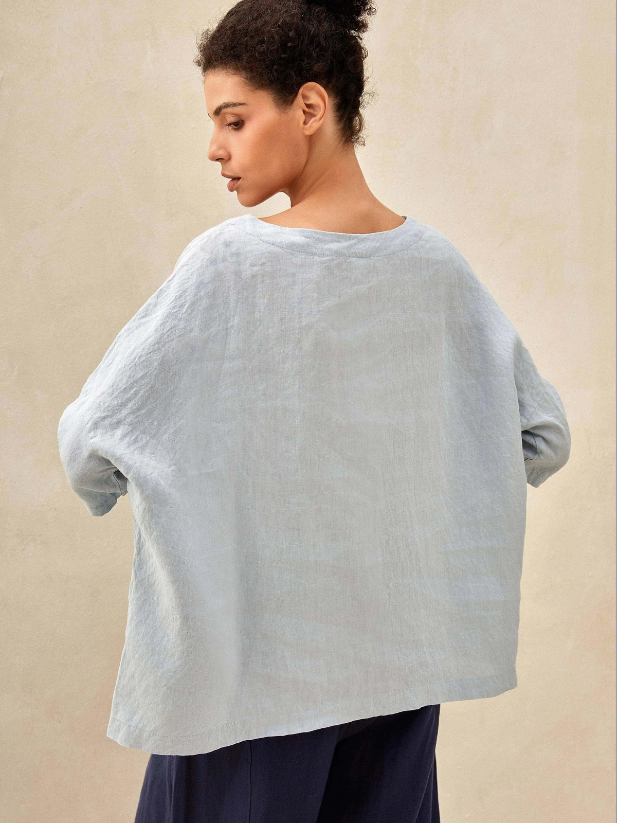 a woman in a sweater