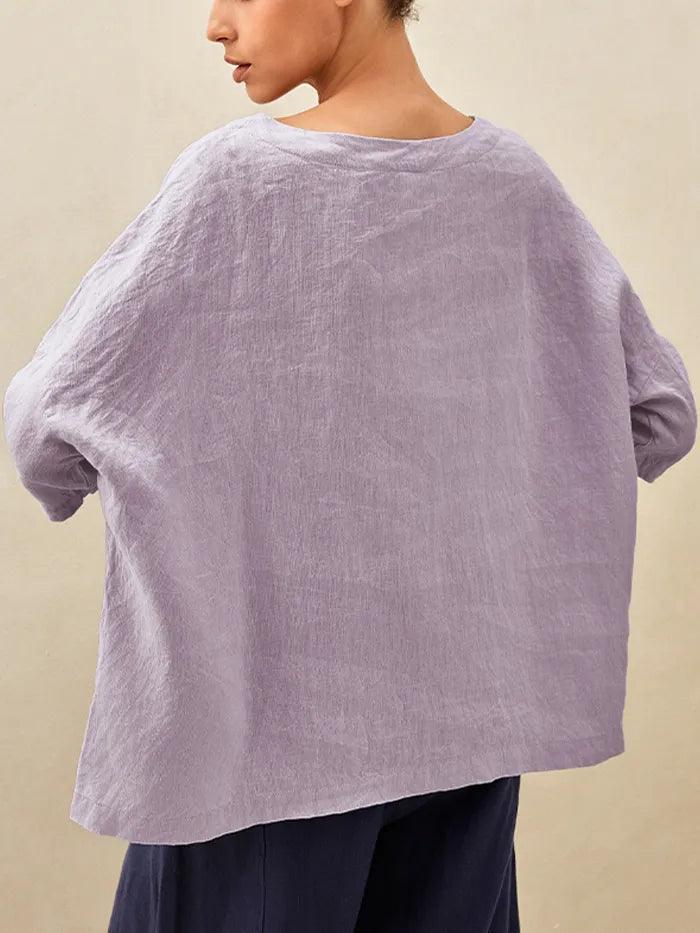 a person wearing a purple shirt