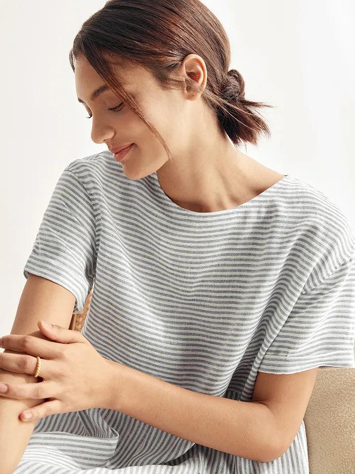 a woman in a striped shirt