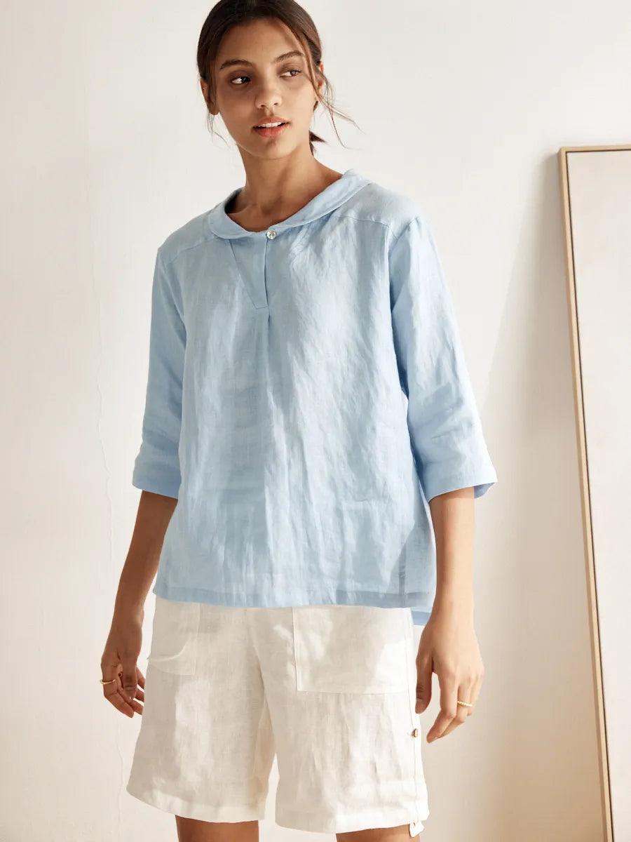 a woman in a blue shirt