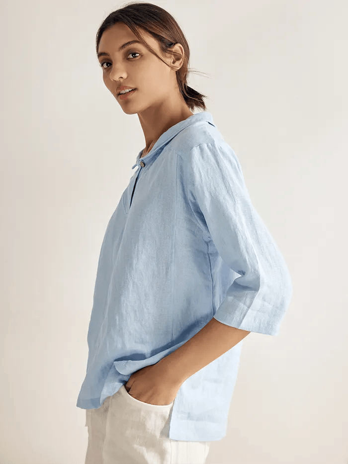 a woman in a blue shirt