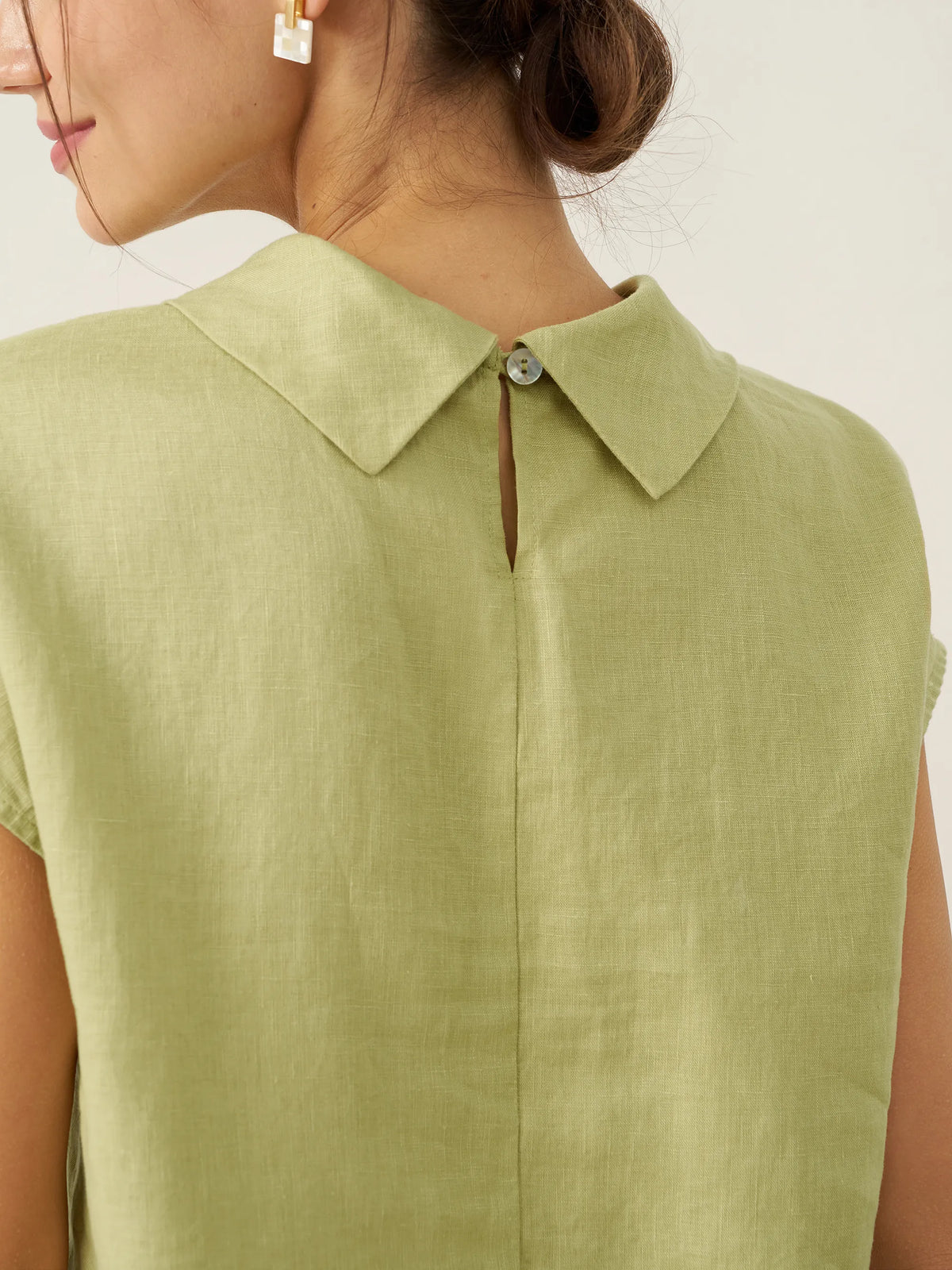 a woman wearing a green shirt