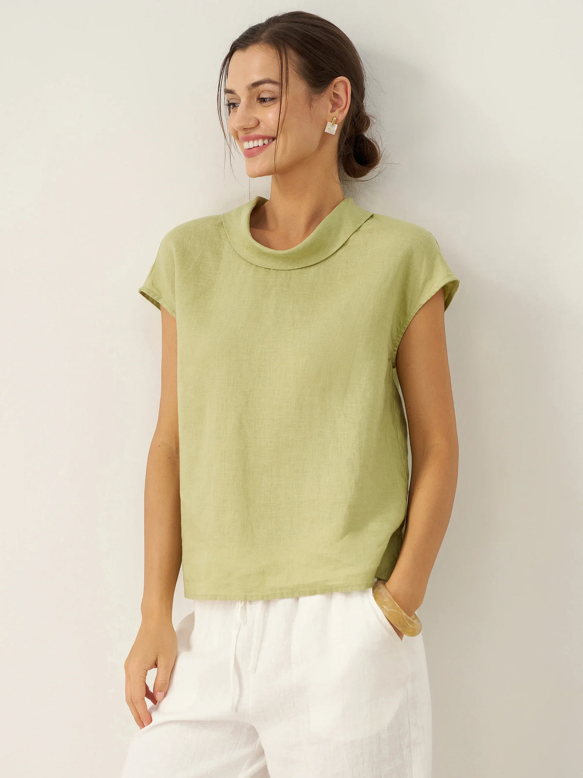 a woman in a green shirt