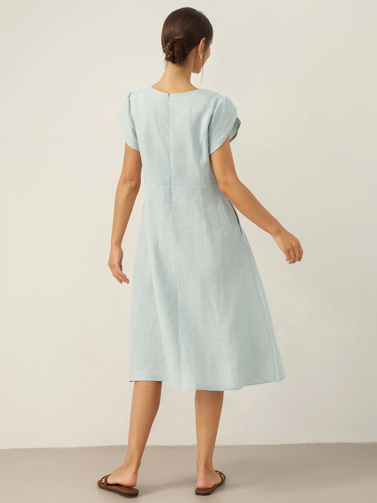 a woman in a light blue dress