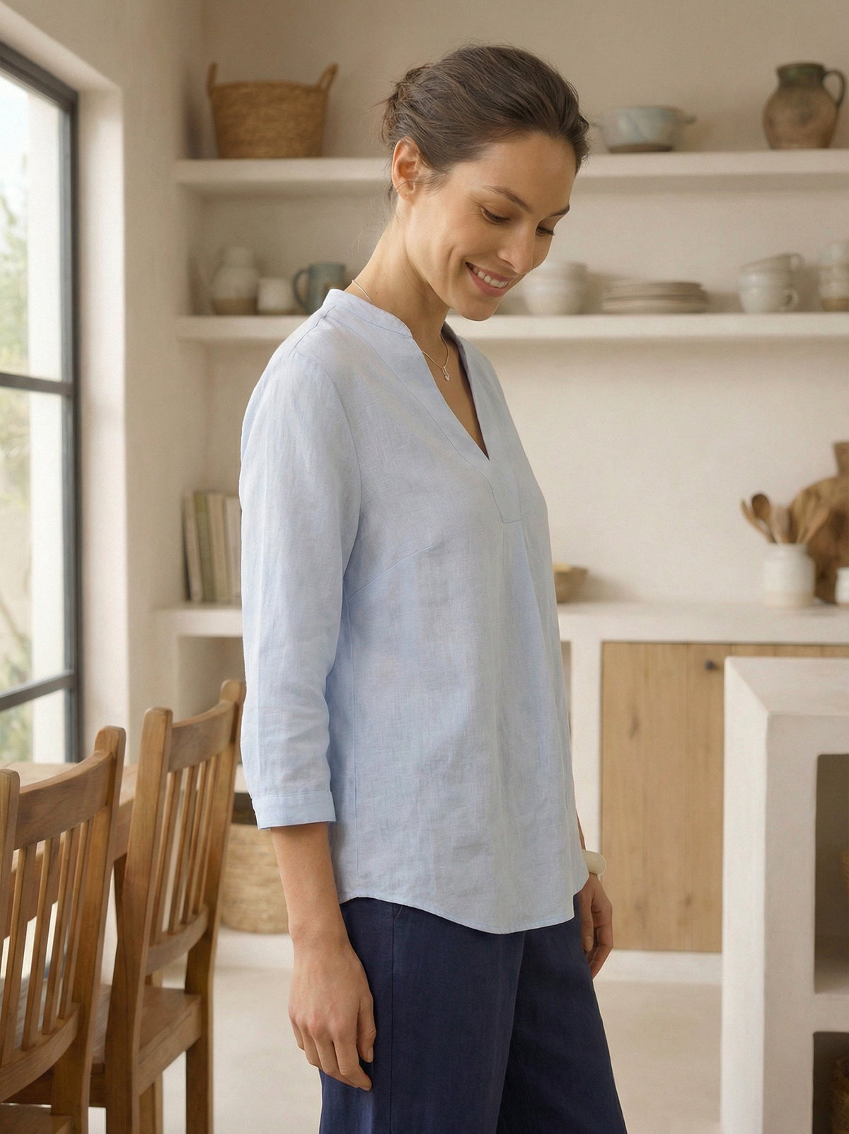 a woman smiling in a room