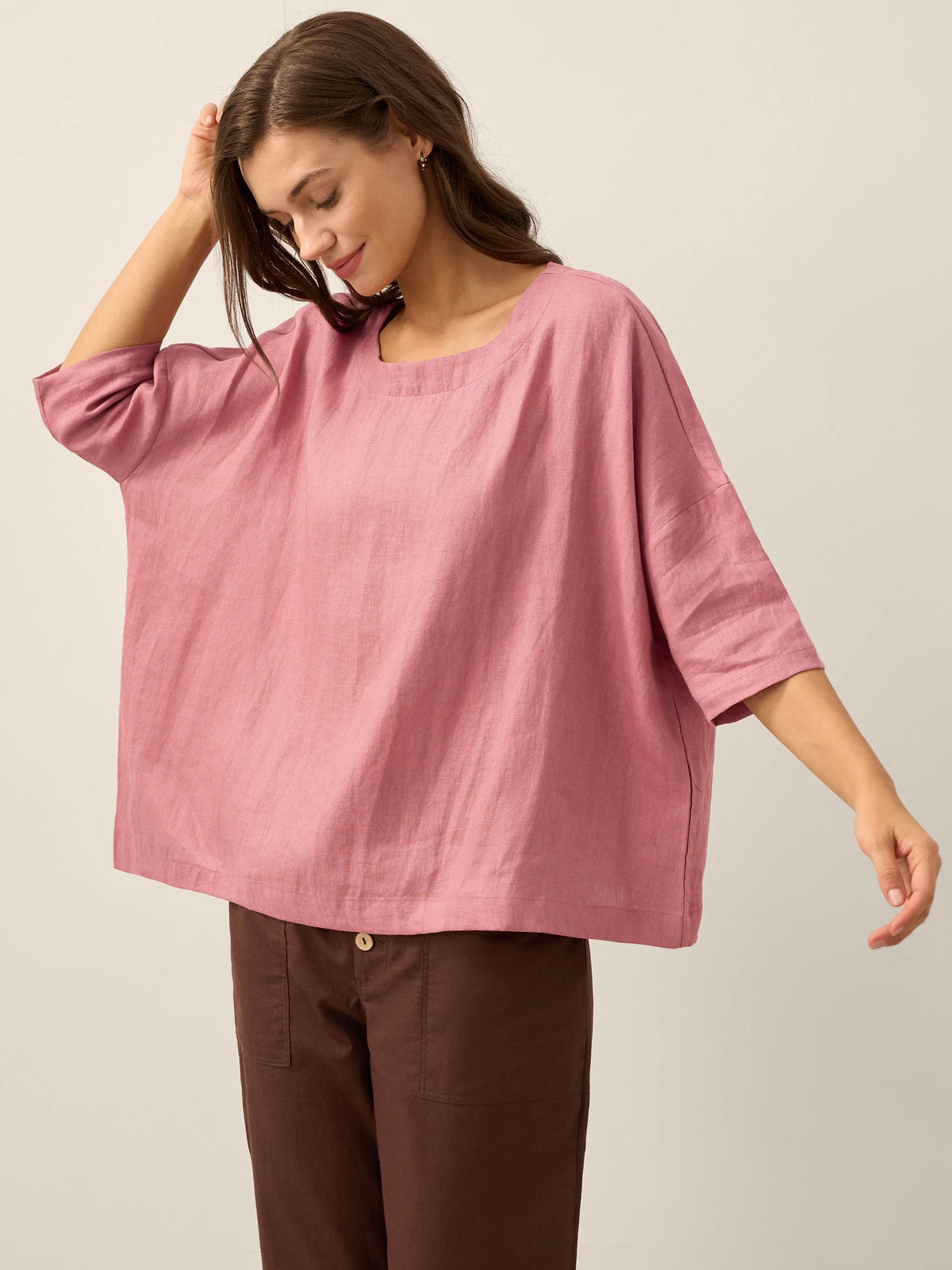 a woman in a pink shirt