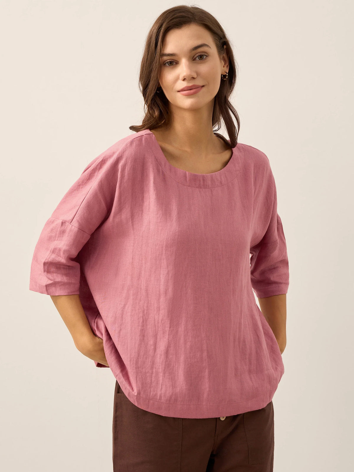 a woman in a pink shirt
