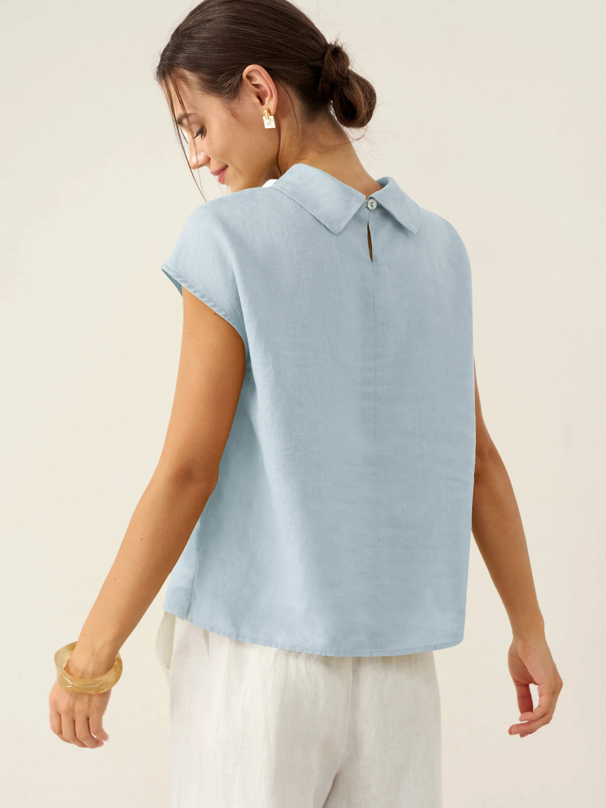a woman in a light blue shirt
