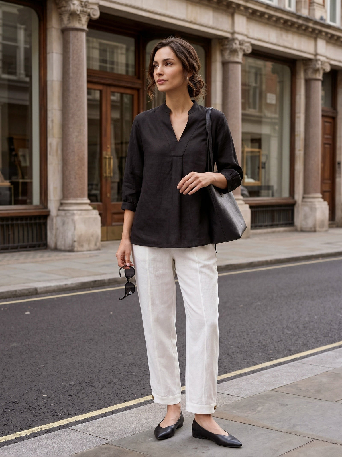 a woman standing on the sidewalk
