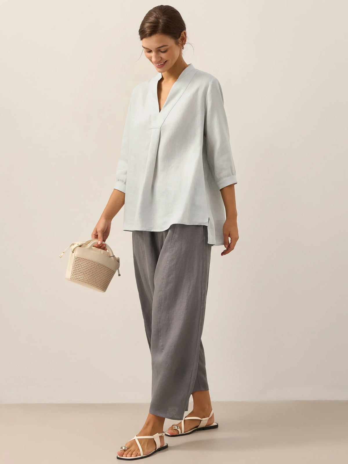 a woman holding a basket